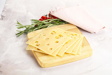 Sliced maasdam cheese with holes