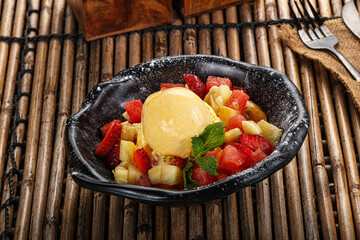 Sweet fruit salad with ice cream
