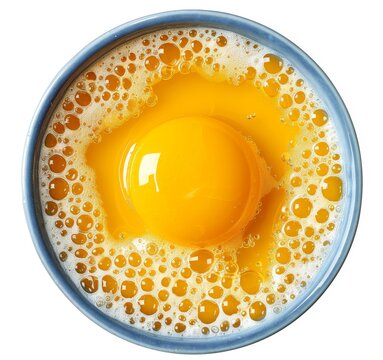 recommend clip art: A top-down view of an egg yolk in the center, surrounded by yellowish liquid with bubbles and tiny foam on a white background.