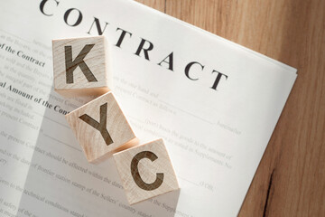 KYC - letters on wooden cubes. KYC - short for know your customer our client