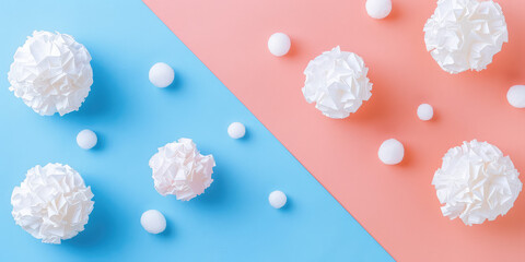 Abstract cute background with white textured paper balls on pastel background with copy space.