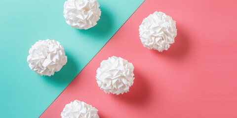 Abstract cute background with white textured paper balls on pastel background with copy space.