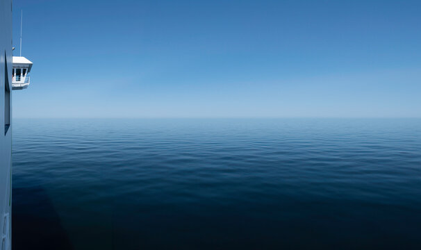 Wheelhouse or Bridge of a ship, viewed from the side. Quiet calm blue sea surface with bow wave. Starboard (right side). Wide image