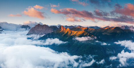 A magical drone view of the Val di Fassa valley. Italian Alps, Dolomites, South Tyrol, Europe.