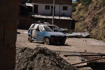 small car abandoned and destroyed by time, full of rust