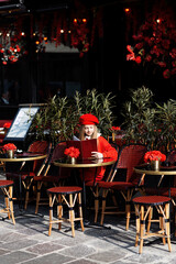 Lifestyle portrait of a stylish girl.Girl in a red beret. Children's fashion.