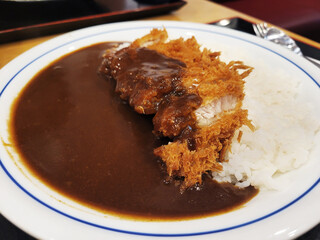 Crispy fried pork cutlet with curry and rice, Japanese food style.