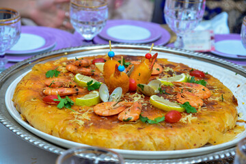 Moroccan pastilla or bastila with seafood, shrimp and calmari