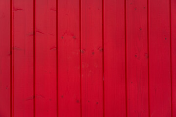 dyed red color wood planks texture, background. house exterior decoration