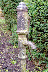 Well hand pump in the garden - Vintage