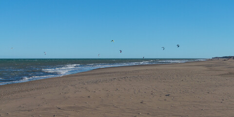 kitesurfing at the seashore on a windy afternoon