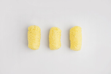 Tasty corn sticks on white background