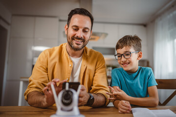 Father and son connect and install cctv security surveillance camera