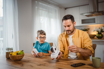 Father and son connect and install cctv security surveillance camera