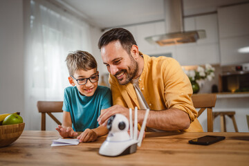 Father and son connect and install cctv security surveillance camera
