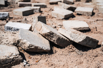 paving slabs on the destroyed damaged pedestrian sidewalk close-up
