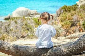 happy child playing by the sea