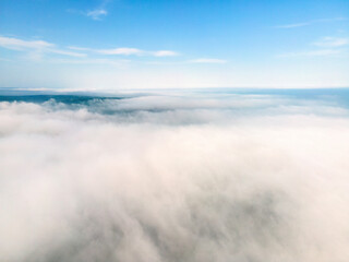 Beautiful nature white clouds Aerial view, blue sky horizon shooting from drone on sunny day high in the atmosphere front view