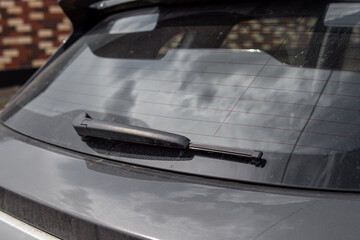 The rear window on car and wiper. Natural