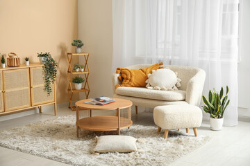Light living room with white sofa, coffee table, chest of drawers and curtains