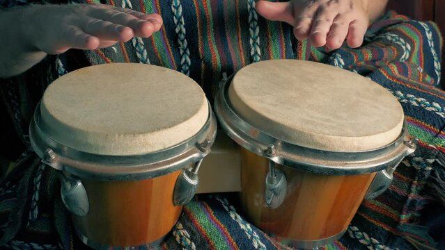 Man Plays The Bongos Hand Percussion