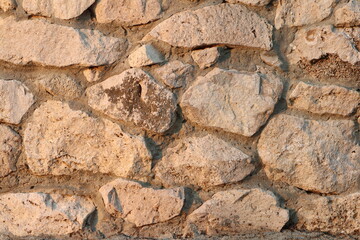 White stone wall at sunset