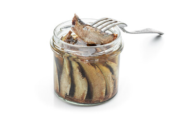 Smoked Sprats in glass jar isolated on a white background