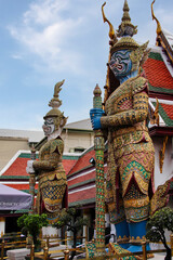 Statues of the demon guard at the entrance of the Wat Phra Kaew temple (Thailand, Bangkok), they are called Yaksha mythological creatures who protect the sacred places