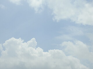 Puffy cumulus clouds forming within a blue sky over Kent County, Delaware. 