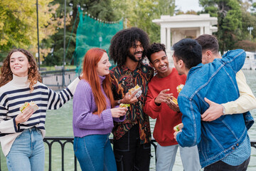 Young people meeting and sharing moments of friendship enjoying ethnic diversity.
