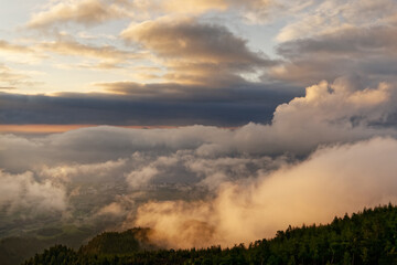 The setting sun colours striking and contrasting cloud formations, Azores, Sao Miguel, area Lagoa do Fogo.