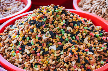 traditional Uzbek sweet mix of various varieties of nuts, dried fruits, oriental sweets close-up