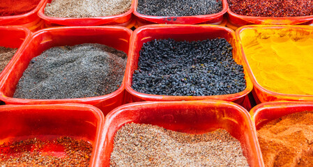 assortment of various oriental turkish spices on the counter at the arabic bazaar in Turkey