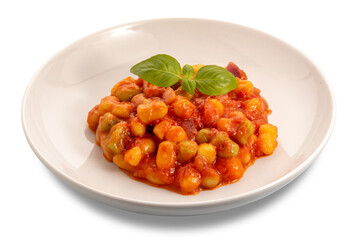 Potato dumplings with tomato sauce and basil leaves in white plate isolated
