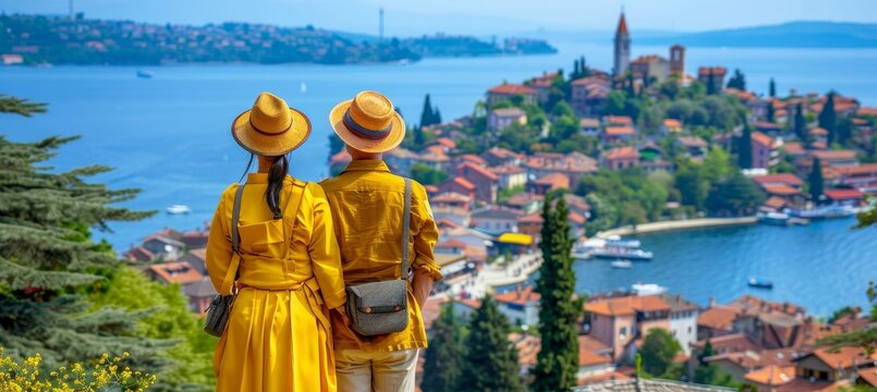 Senior couple relishing the cityscape and ocean view on their enjoyable summer vacation getaway
