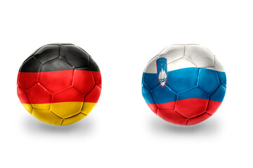 Fototapeta premium football balls with national flags of germany and slovenia ,soccer teams. on the white background.
