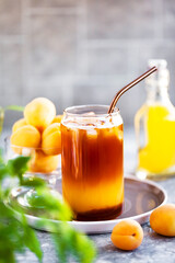 Bumble coffee - refreshment summer iced cocktail with espresso, orange juice, caramel syrup and ice