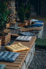 soft pillows on the bench for comfortable seating of people
