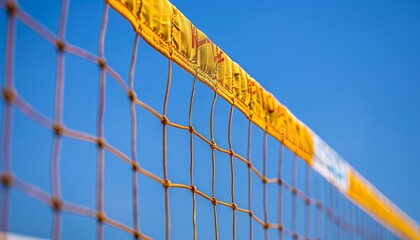 Beach volleyball net under blue sky, outdoor setting, summer olympics sport concept