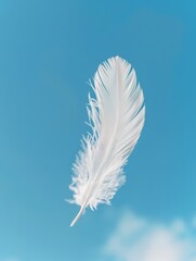 Obraz premium A delicate feather floating freely in the wind against a clear blue sky, generated with AI