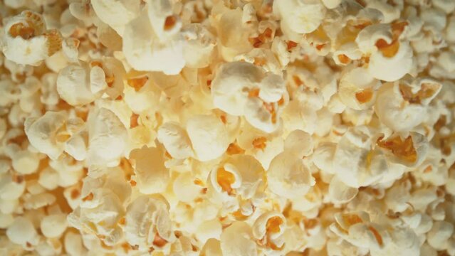 Super Slow Motion Shot of Falling Fluffy Popcorn Followed by Camera at 1000 fps.