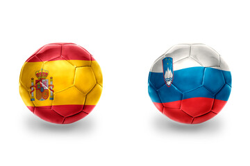 Fototapeta premium football balls with national flags of spain and slovenia ,soccer teams. on the white background.