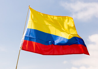 Yellow, blue, and red tricolor flag of Colombia, symbol of national culture and history,...