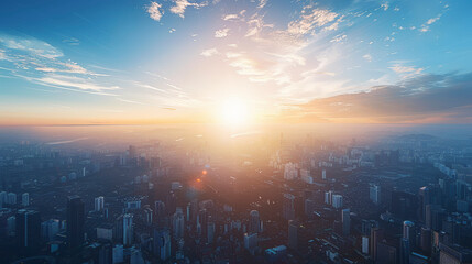Obraz premium A breathtaking sunrise illuminating a sprawling urban skyline, with buildings and skyscrapers emerging from the morning mist.