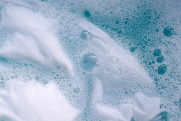 Naklejka premium White cloth soaked in powder detergent water dissolution, washing cloth. Laundry concept