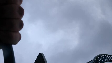 Experience the excitement of a thrilling roller coaster ride amidst the vibrant fall foliage in a lush autumn setting