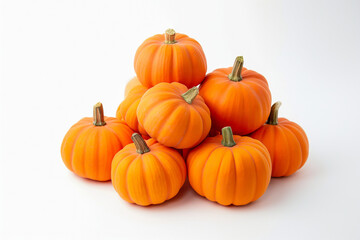 A pyramid of small, bright orange pumpkins arranged on a white background.