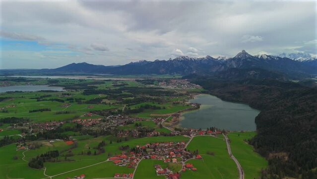 Lake Weissensee near Fuessen, Ostallgaeu, Allgaeu, Swabia, Bavaria, Germany. Weissensee Nature Park. Large beautiful lake with clean clear blue water in the south of Germany in the city of Fussen. 