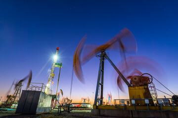 oil drilling rig in the evening