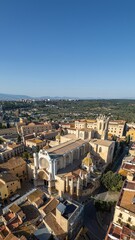 Fototapeta premium cathedral and cozy streets with ancient architecture of coastal town Tarragona, Spain, aerial drone view